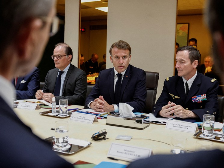 French President Emmanuel Macron (C}, flanked by Presidency General Secretary Emmanuel Moulin (L) and Chief of Military Staff of the President of the Republic (CEMP) Fabien Mandon, holds a Defence and National Security Council meeting following US air strikes on nuclear facilities in Iran, at the Elysee Palace in Paris on June 22, 2025.